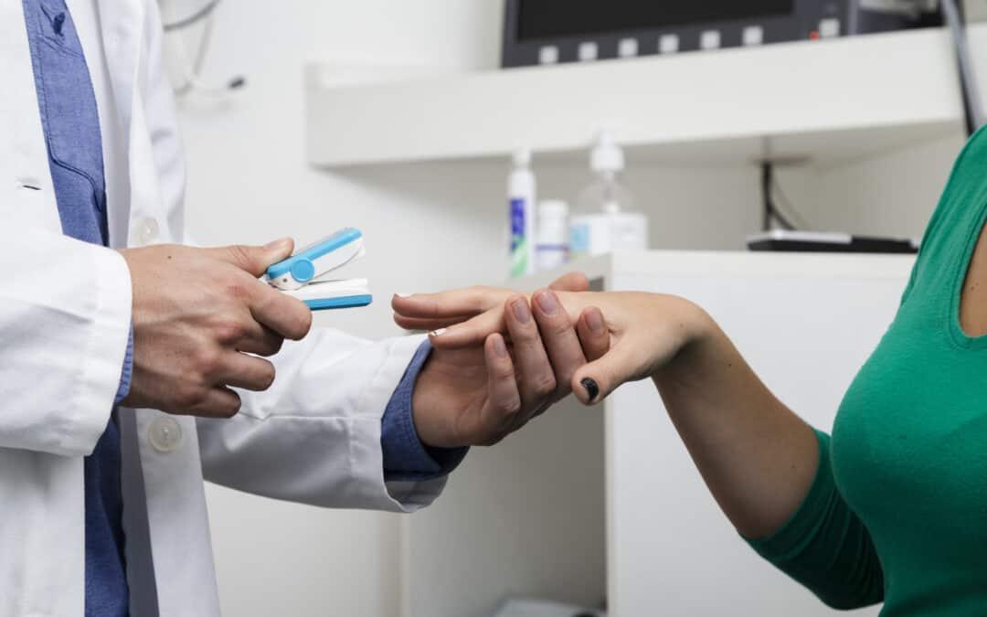 Doctor checkingusing medical equipment with a patient