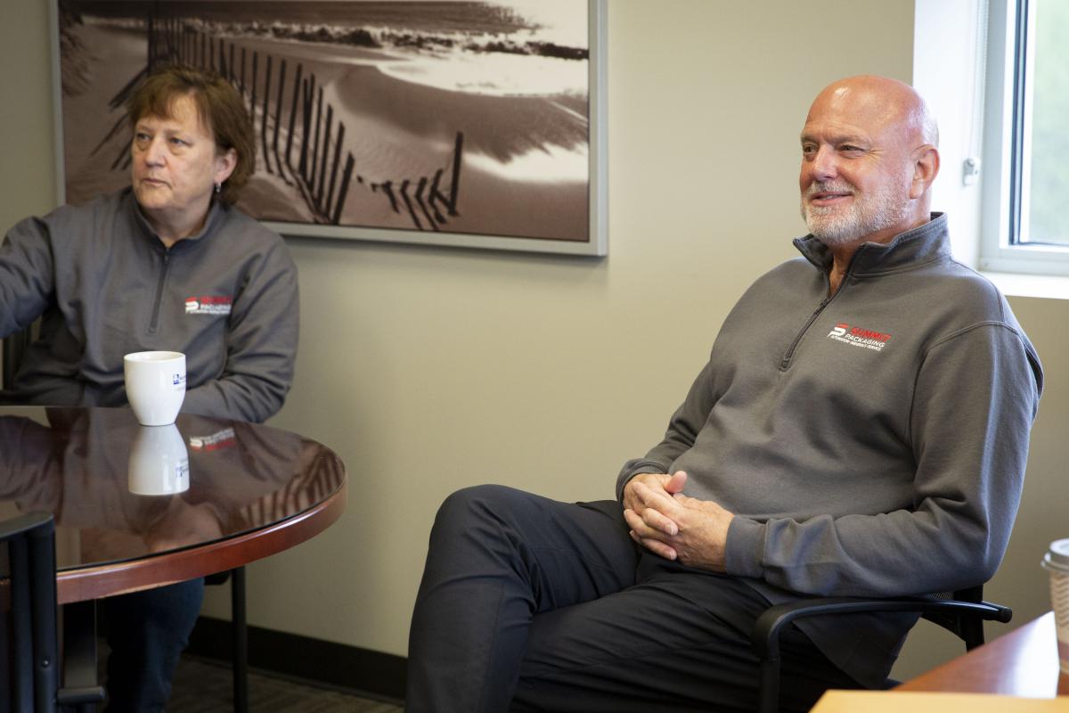 Summit team members sitting in a meeting